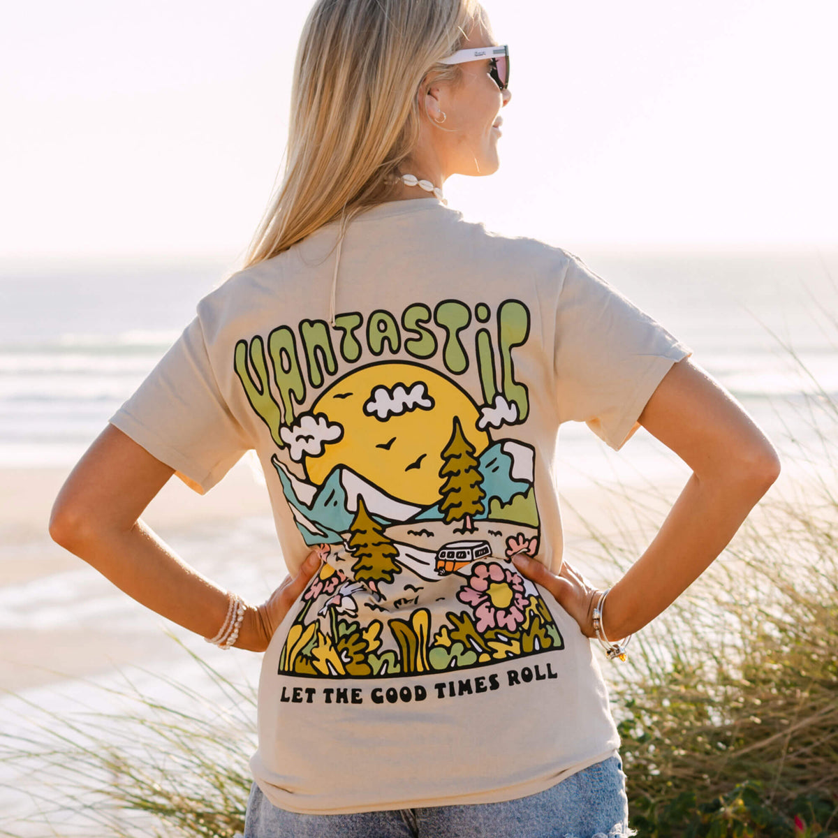 Woman wearing a t-shirt with a graphic design on the beach